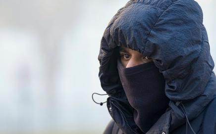 A man covers himself to protect from the cold on a winter morning in Delhi. (Pic/PTI)